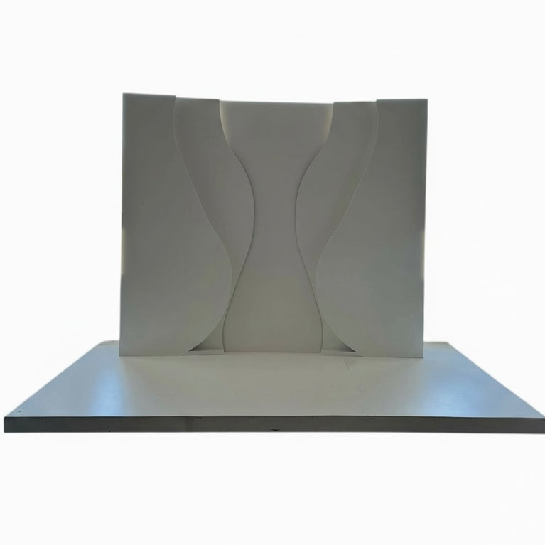 White decorative wall panel with wavy design on a white background