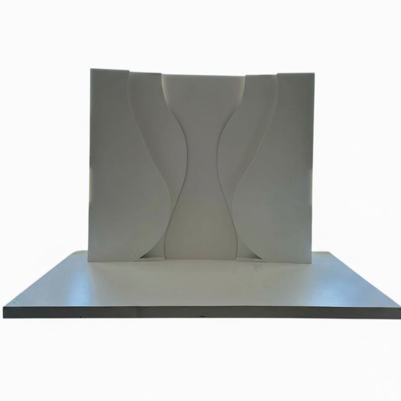 White decorative wall panel with wavy design on a white background